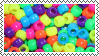 a deviantart stamp with a picture of rainbow beads